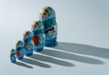 A picture of Russian dolls scaling down in size to represent Moore's Law which predicted the halving of transistors sizes with each new generation leading us to the IBM 2nm breakthrough - a world's first and smallest processor.